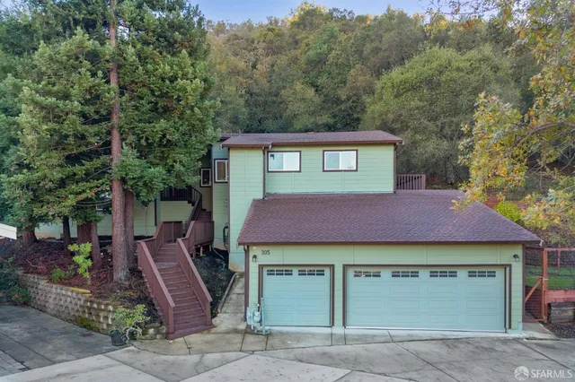 an aerial view of a house with a garden
