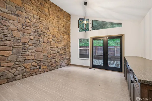 a view of a bathroom with a sink and next to a window
