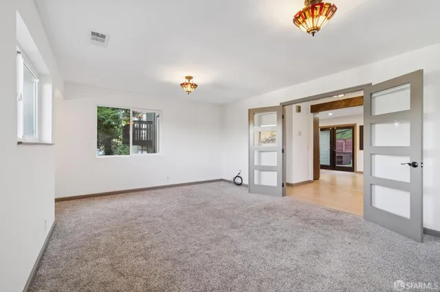 wooden floor in an empty room with a fireplace