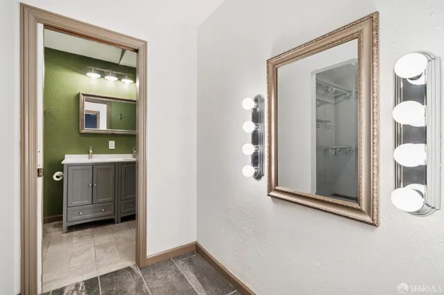 a bathroom with a white bathtub and toilet