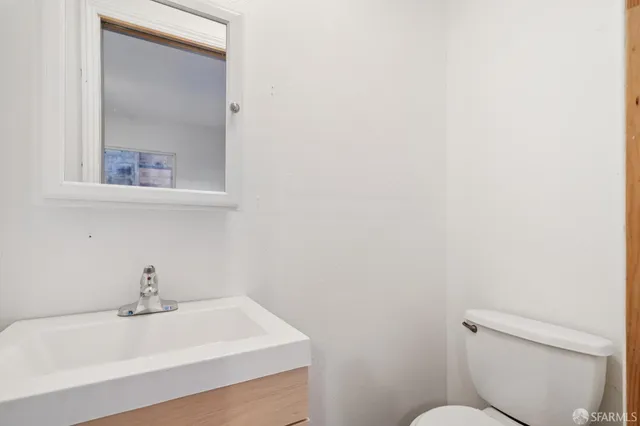 a view of an old house with wooden stairs