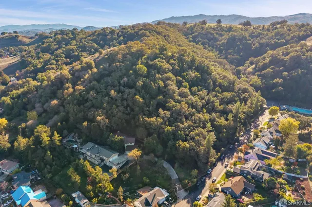 a view of a kitchen with a sink and cabinets