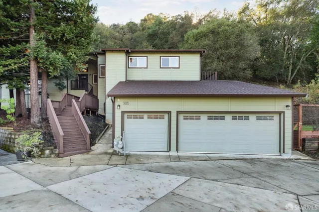 a kitchen with stainless steel appliances a refrigerator and a stove top oven