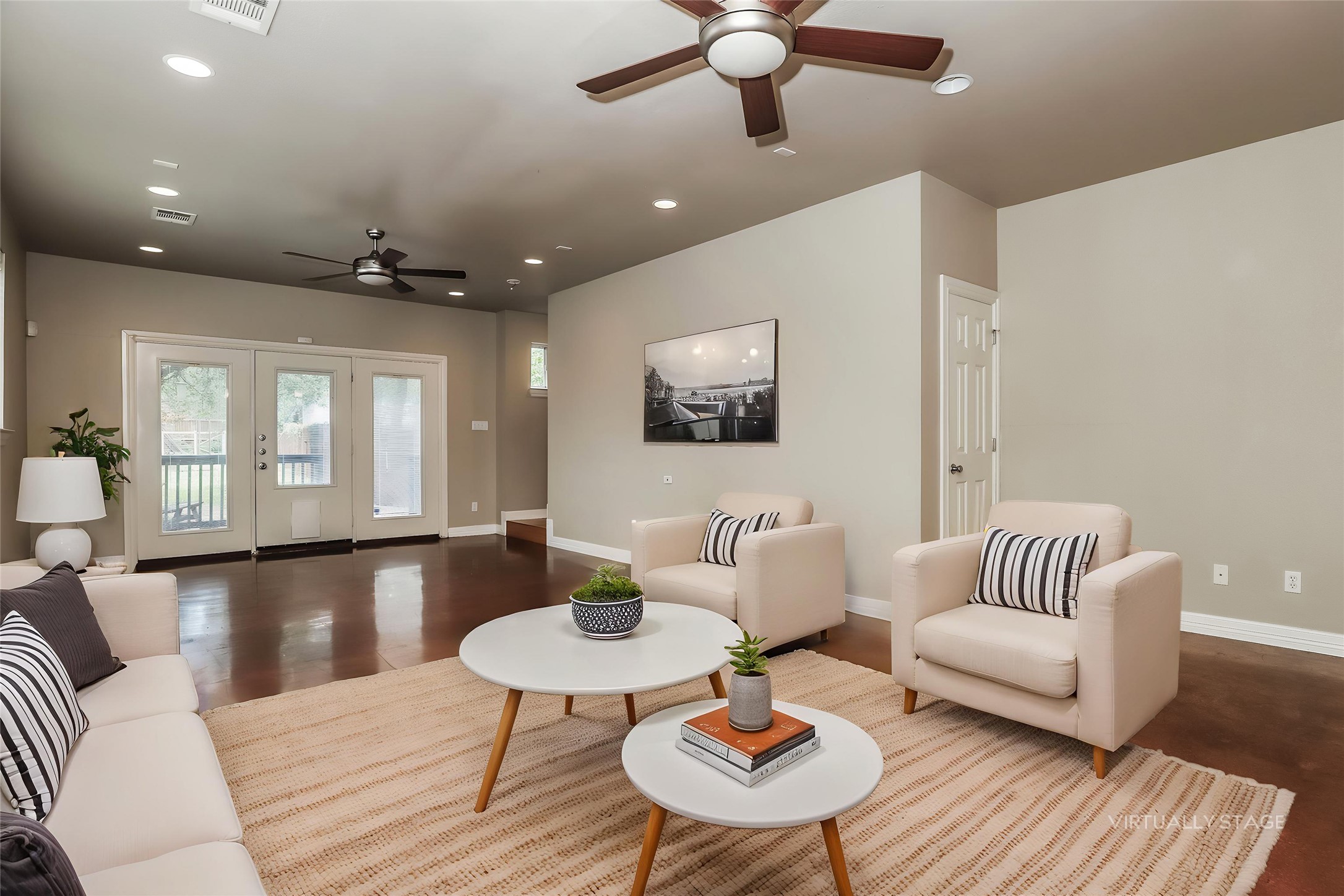 1701 Sanchez Street, Unit A Austin, TX 78702 - Photo 2 of 19 Hardwood floors and a trio of glass-paned doors create a naturally illuminated living area.