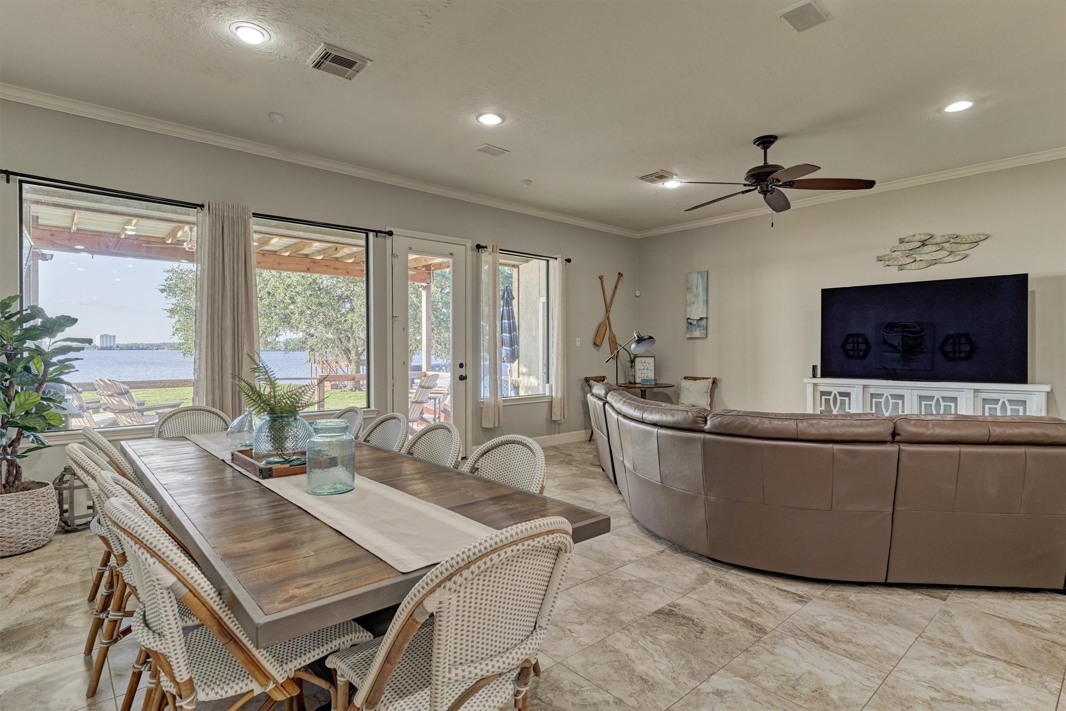 157 Capetown Way Conroe, TX 77356 - Photo 12 of 32 a living room with furniture and a flat screen tv