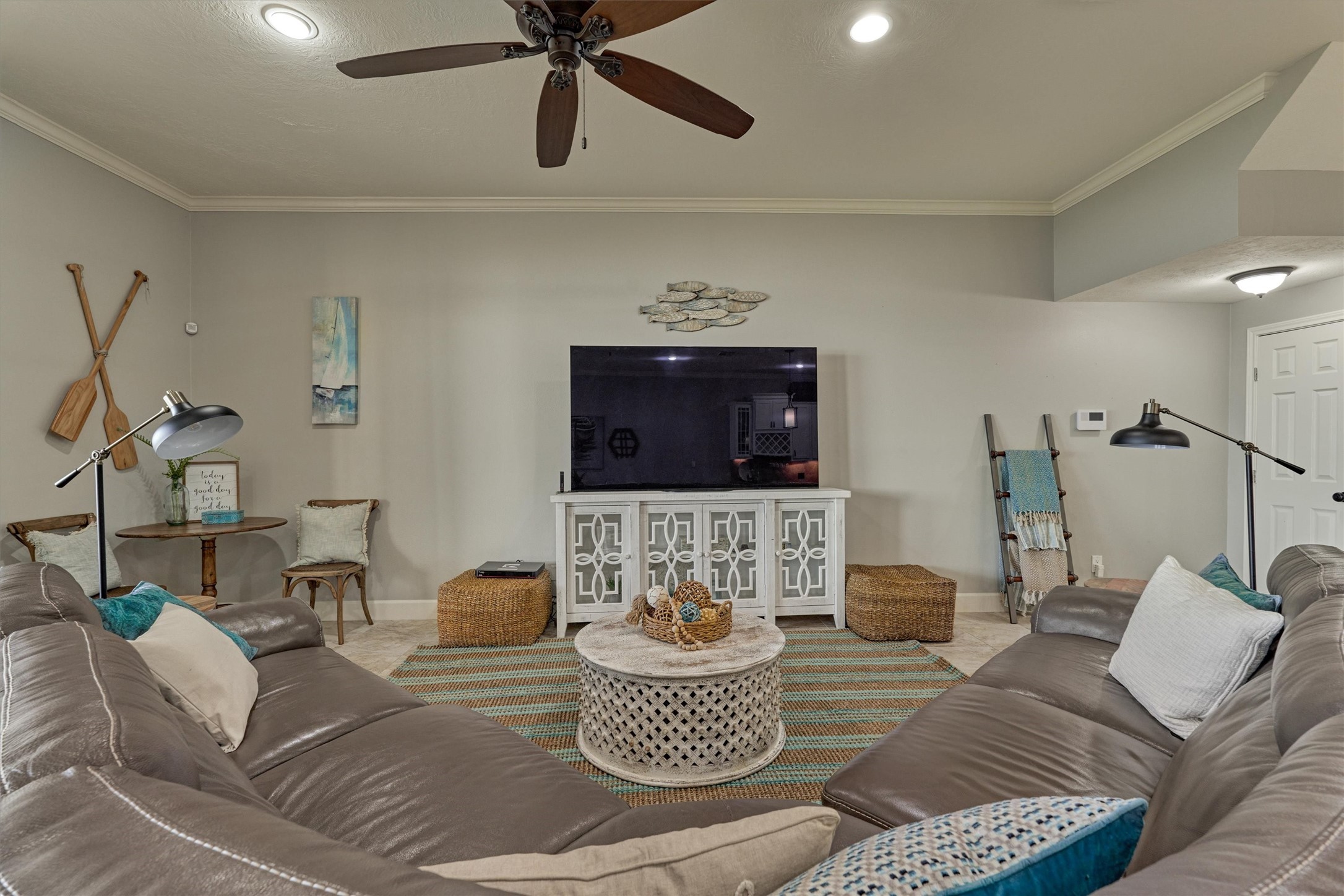 157 Capetown Way Conroe, TX 77356 - Photo 13 of 32 a living room with furniture and a flat screen tv