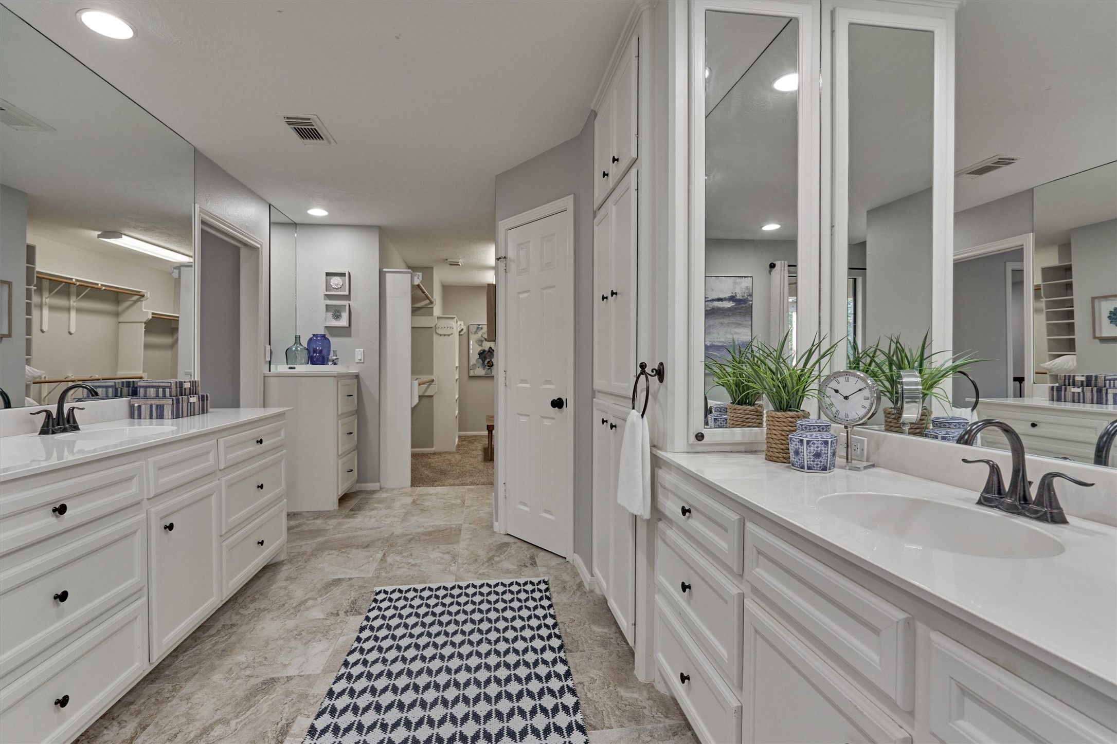 157 Capetown Way Conroe, TX 77356 - Photo 19 of 32 a spacious bathroom with a double vanity sink a mirror and a shower