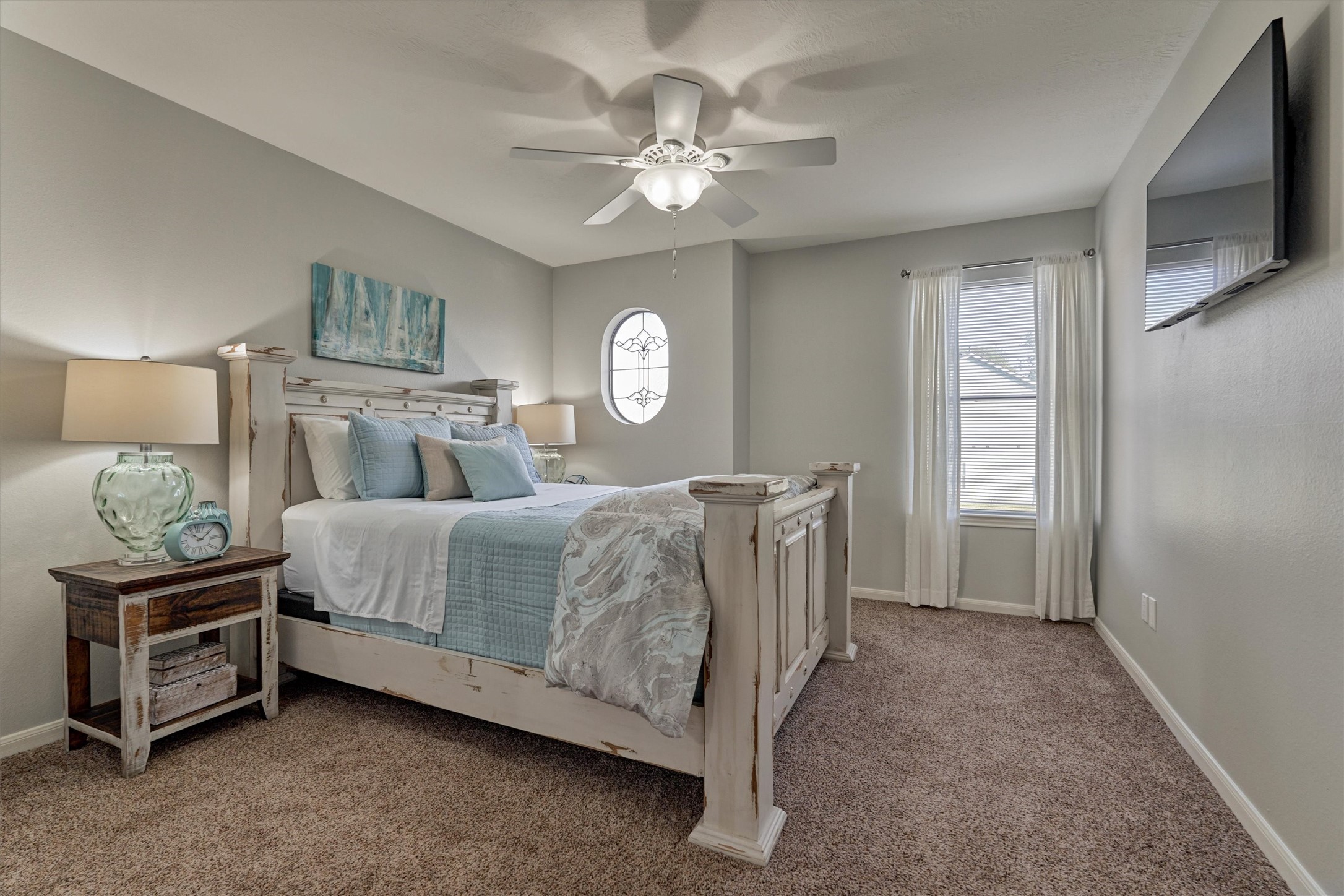 157 Capetown Way Conroe, TX 77356 - Photo 22 of 32 a bedroom with a bed chandelier and a window