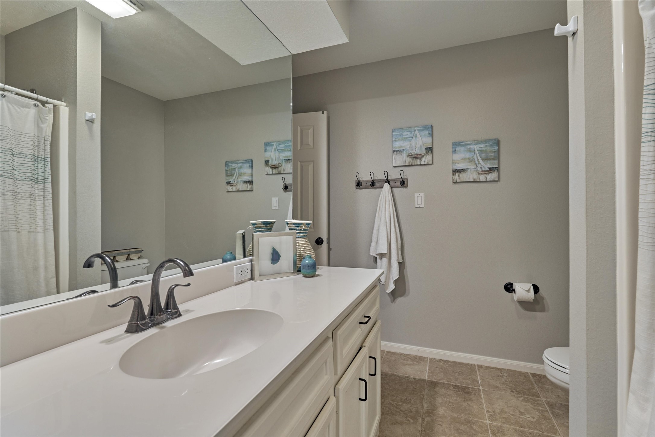157 Capetown Way Conroe, TX 77356 - Photo 24 of 32 a bathroom with a sink toilet and shower