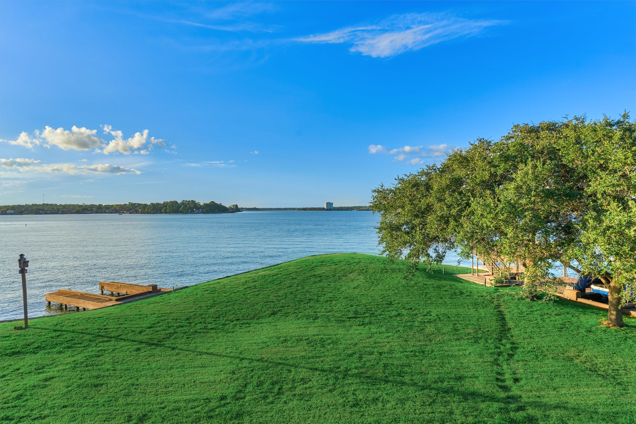 157 Capetown Way Conroe, TX 77356 - Photo 26 of 32 a view of a lake with a big yard