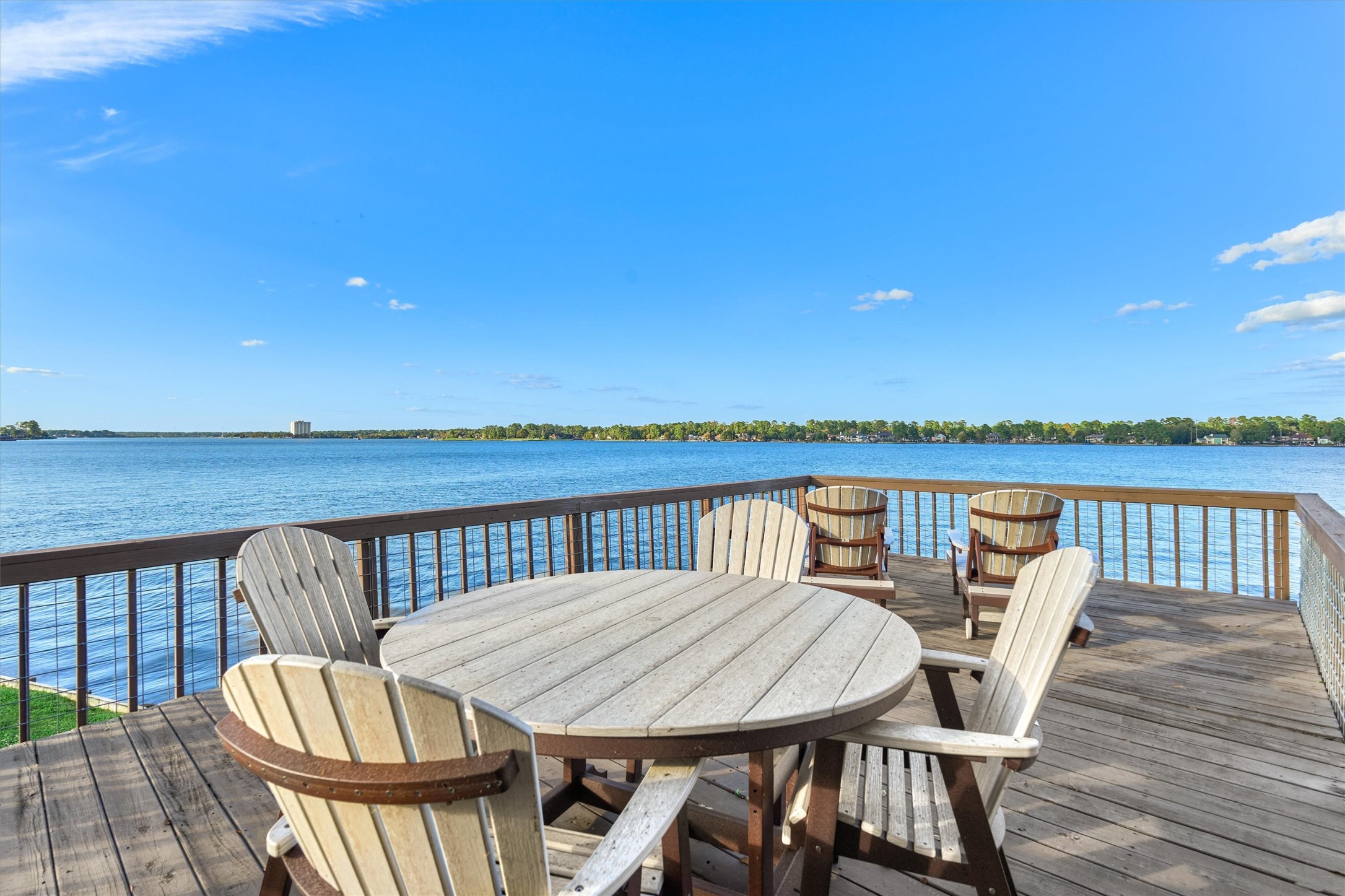 157 Capetown Way Conroe, TX 77356 - Photo 28 of 32 a view of a deck with two chair and wooden floor
