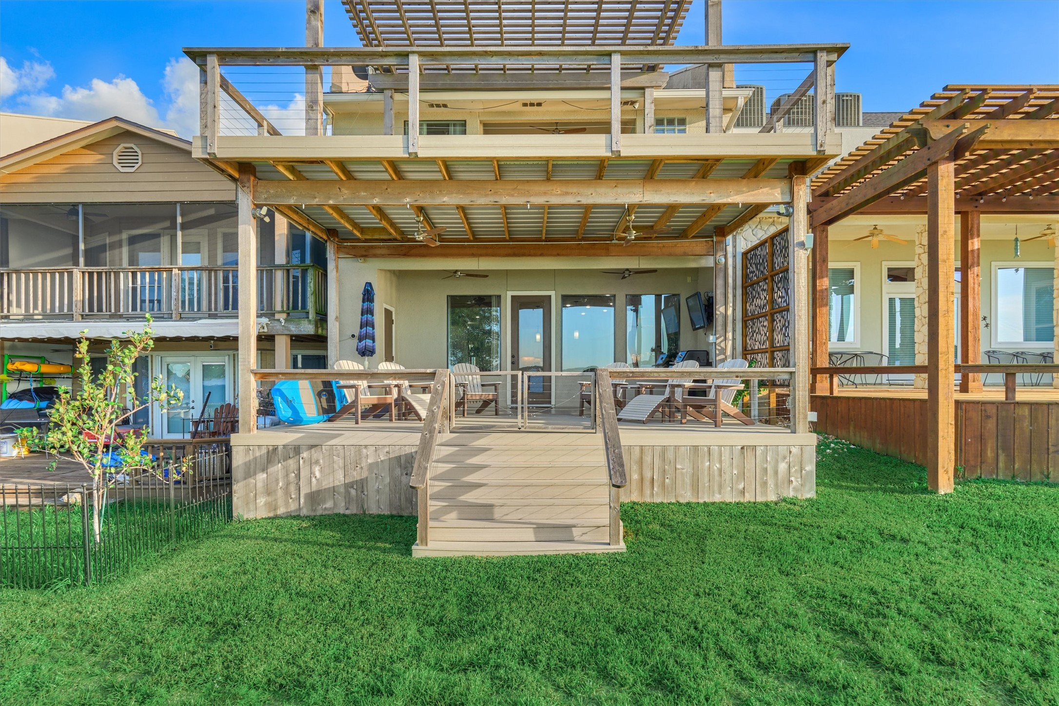 157 Capetown Way Conroe, TX 77356 - Photo 30 of 32 a view of a house with a couches lawn chairs and a yard