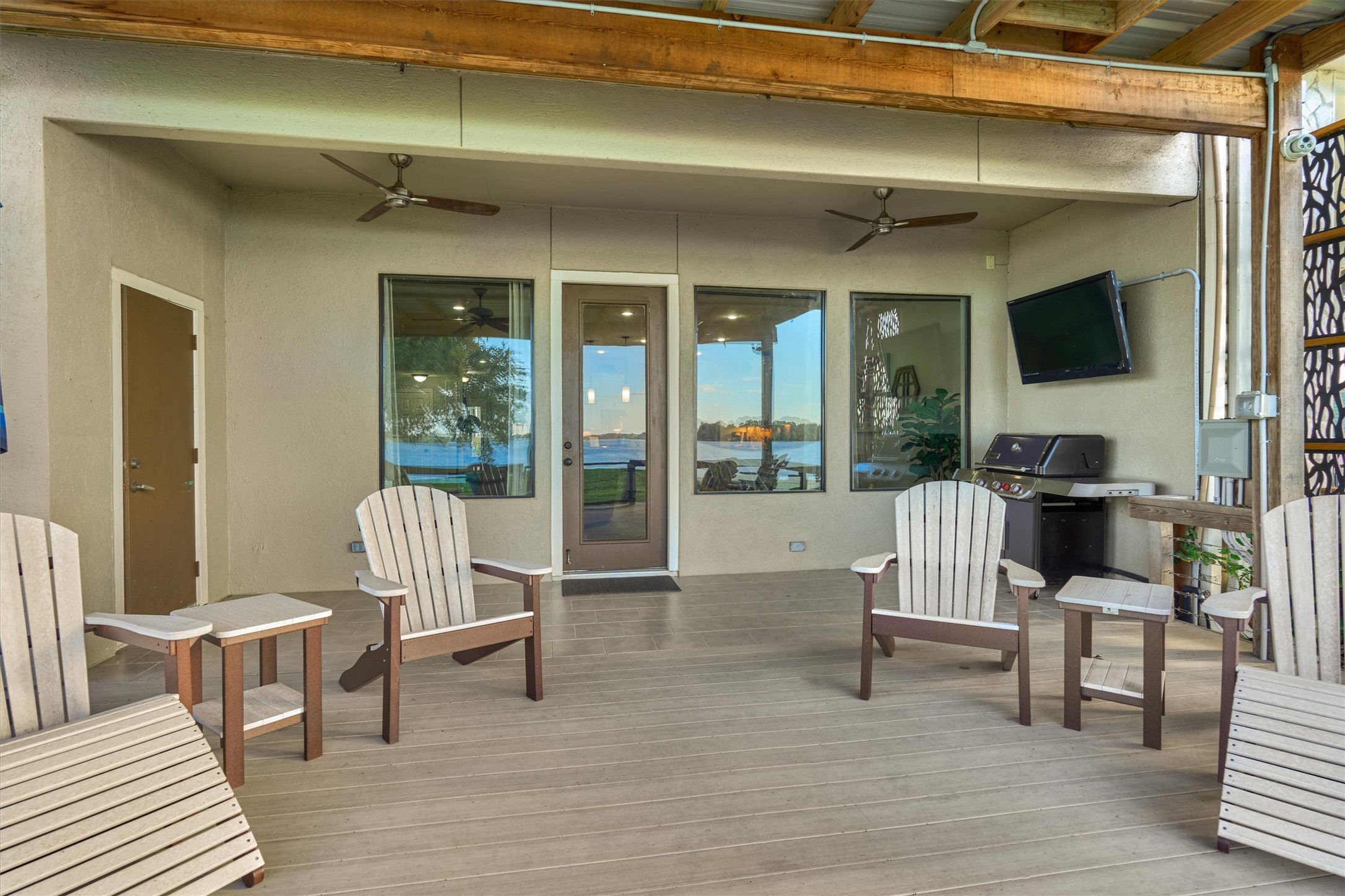 157 Capetown Way Conroe, TX 77356 - Photo 31 of 32 a living room with furniture and a floor to ceiling window