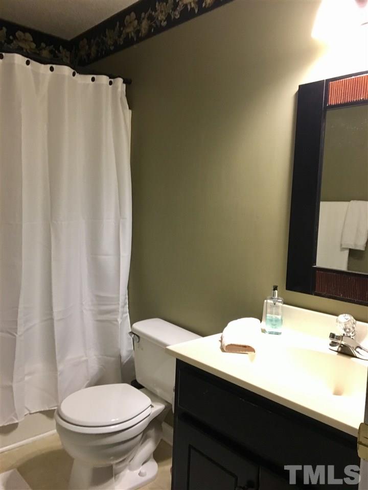 169 South Ridge Drive Garner, NC 27529 - Photo 11 of 20 a bathroom with a sink and a mirror