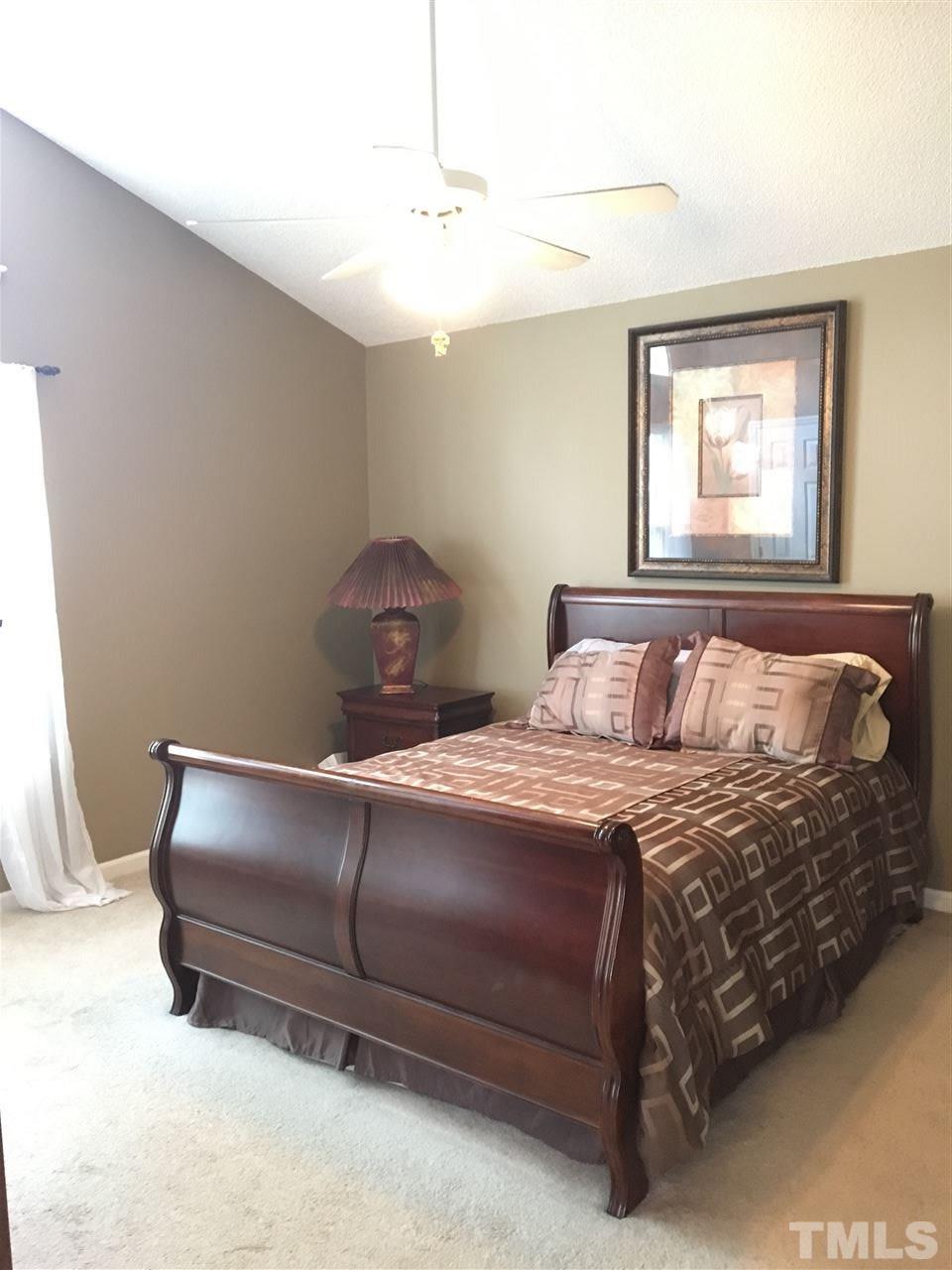 169 South Ridge Drive Garner, NC 27529 - Photo 12 of 20 a bedroom with a bed and window