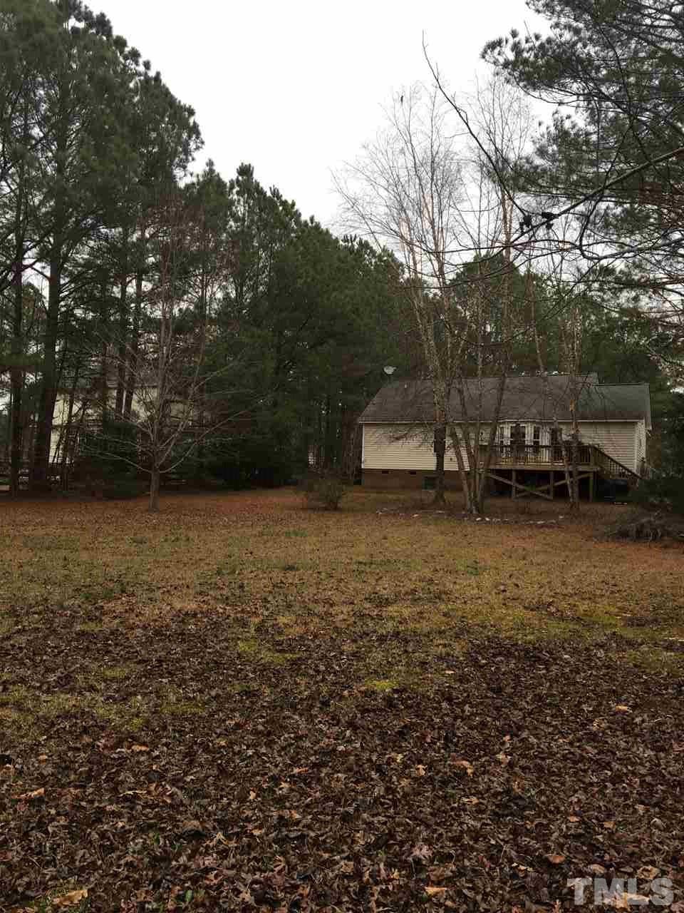 169 South Ridge Drive Garner, NC 27529 - Photo 18 of 20 a view of outdoor space with deck and trees