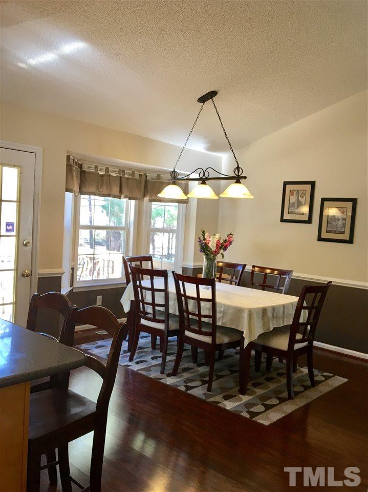 169 South Ridge Drive Garner, NC 27529 - Photo 6 of 20 a view of a dining room with furniture and chandelier