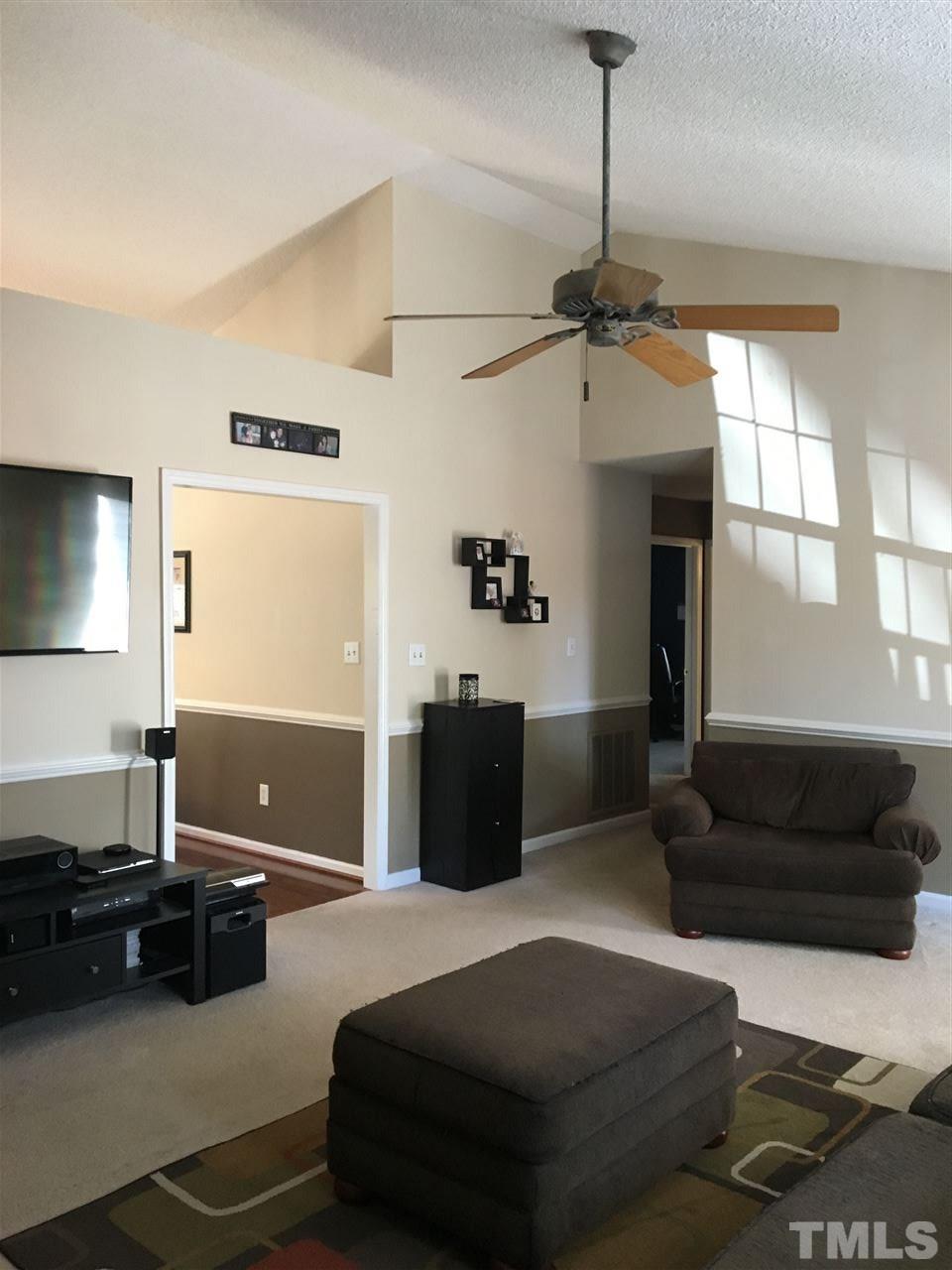 169 South Ridge Drive Garner, NC 27529 - Photo 9 of 20 a living room with furniture and a flat screen tv