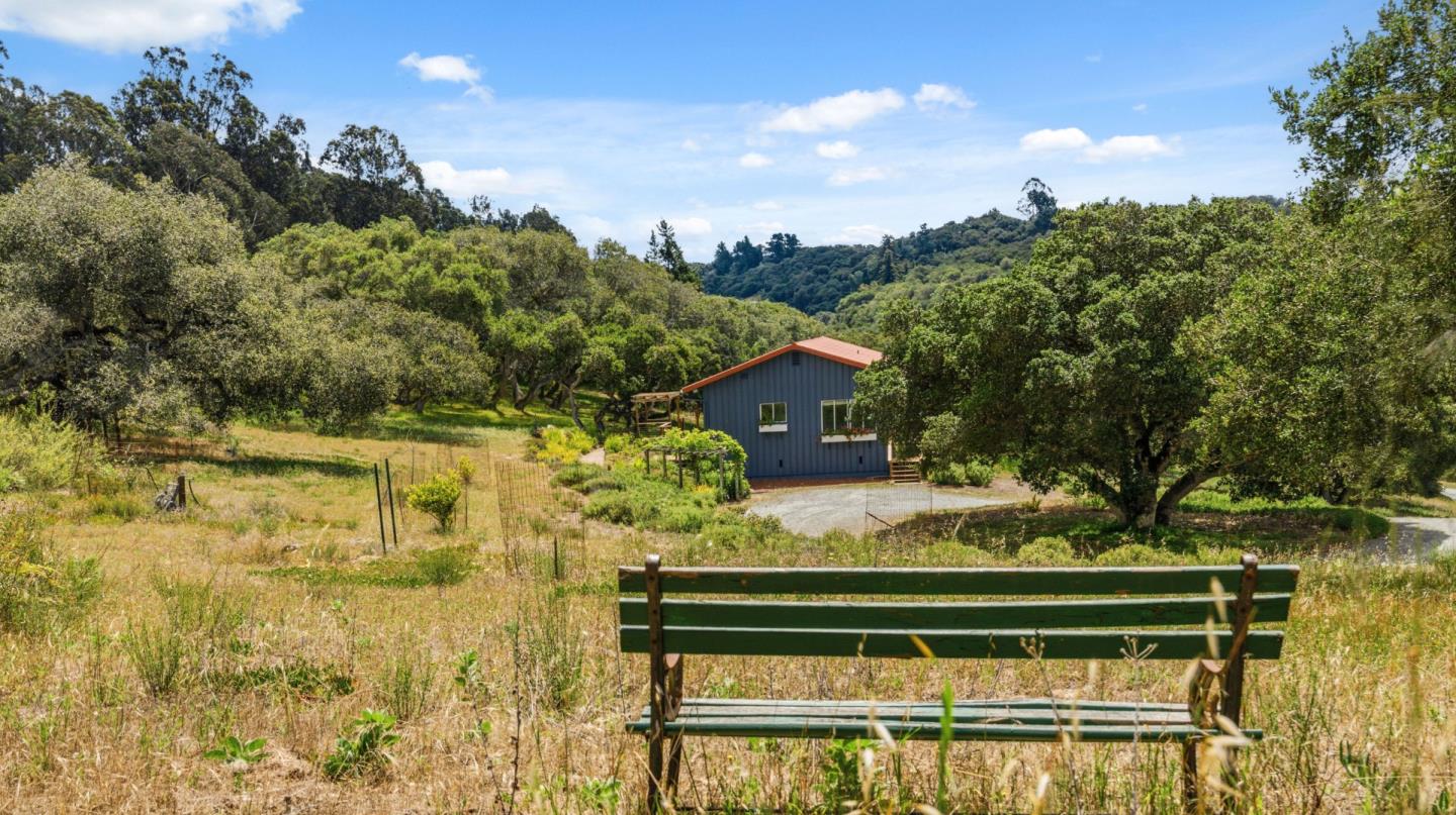 19269 Mallory Canyon Road, Unit D Salinas, CA 93907 - Photo 45 of 77 a view of swimming pool with a garden and trees