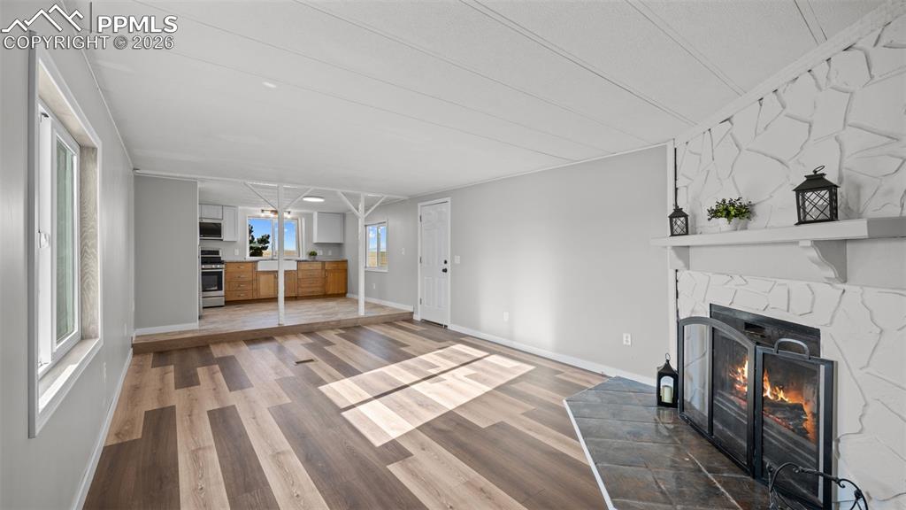 37155 East Jones Road Yoder, CO 80864 - Photo 13 of 50 a bedroom with a bed and a fireplace