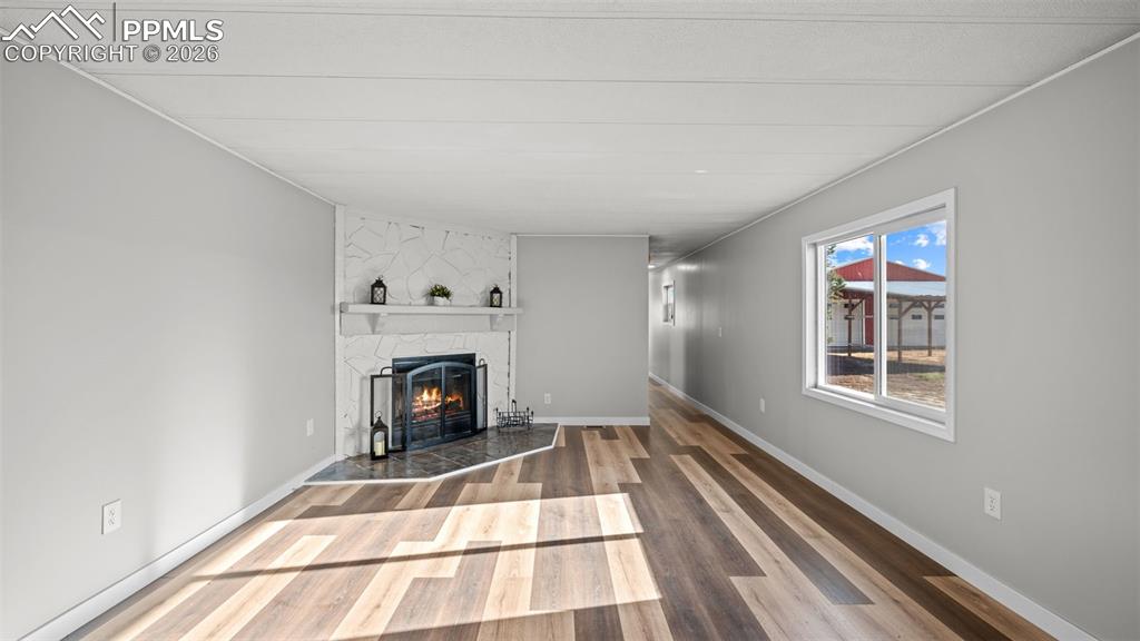 37155 East Jones Road Yoder, CO 80864 - Photo 16 of 50 a view of an empty room with a fireplace