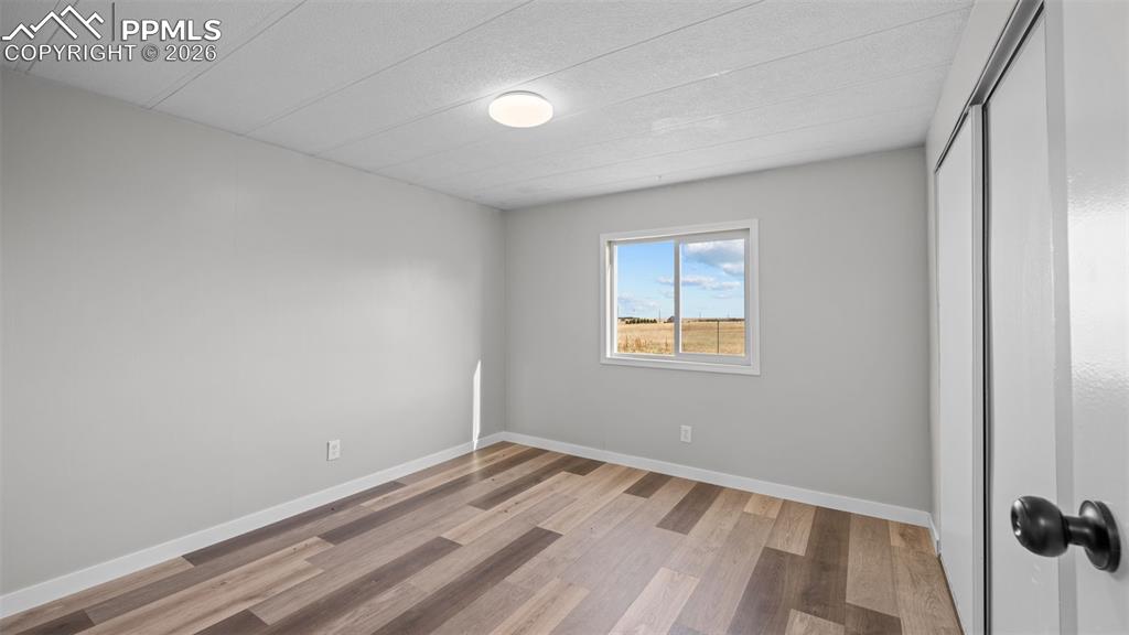 37155 East Jones Road Yoder, CO 80864 - Photo 18 of 50 wooden floor in an empty room