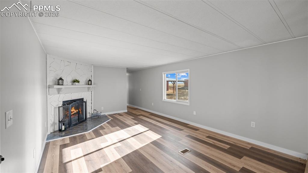 37155 East Jones Road Yoder, CO 80864 - Photo 19 of 50 a view of a livingroom with a fireplace and window