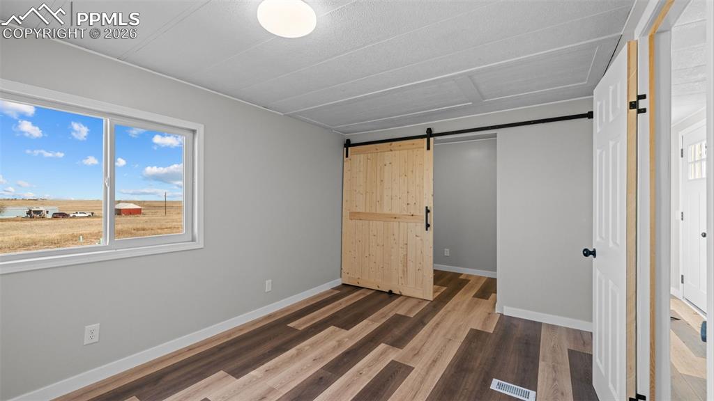 37155 East Jones Road Yoder, CO 80864 - Photo 25 of 50 a view of a room with wooden floor and a window