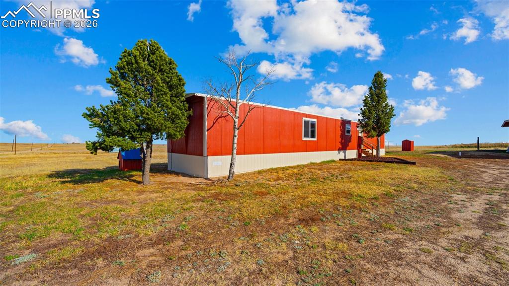 37155 East Jones Road Yoder, CO 80864 - Photo 3 of 50 a view of an outdoor space and blue swimming pool