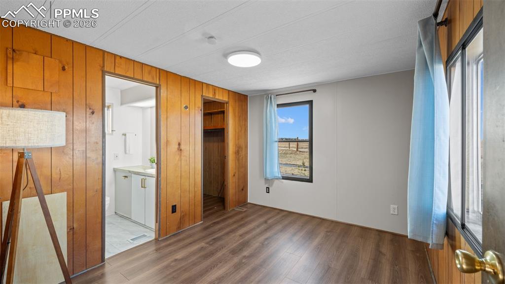 37155 East Jones Road Yoder, CO 80864 - Photo 31 of 50 an empty room with wooden floor and a window