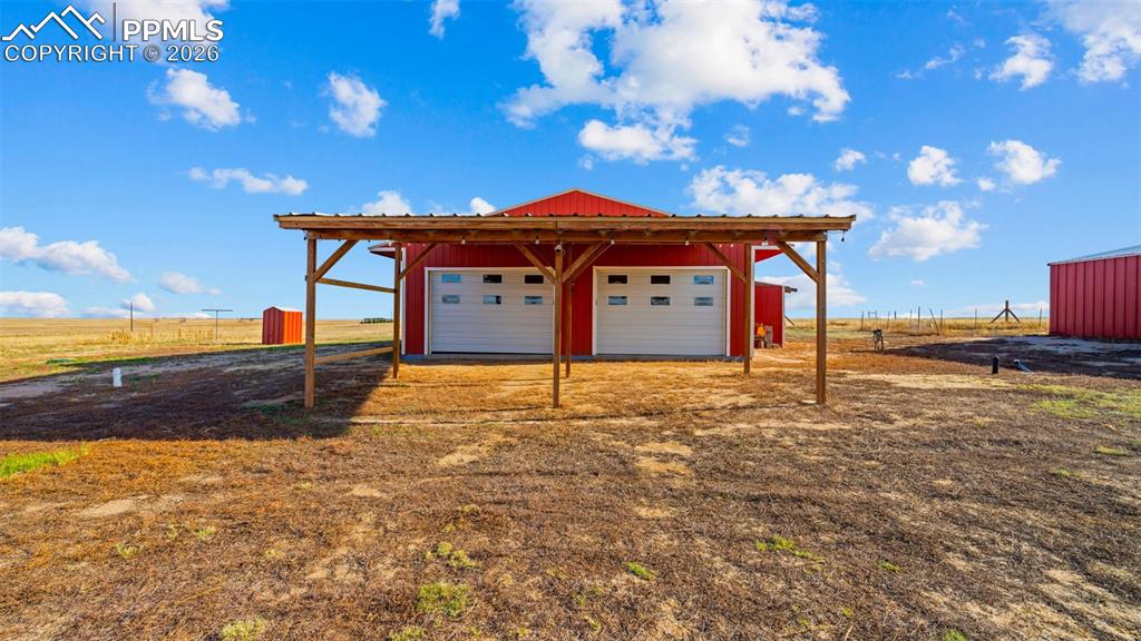 37155 East Jones Road Yoder, CO 80864 - Photo 43 of 50 a backyard of a house with table and chairs