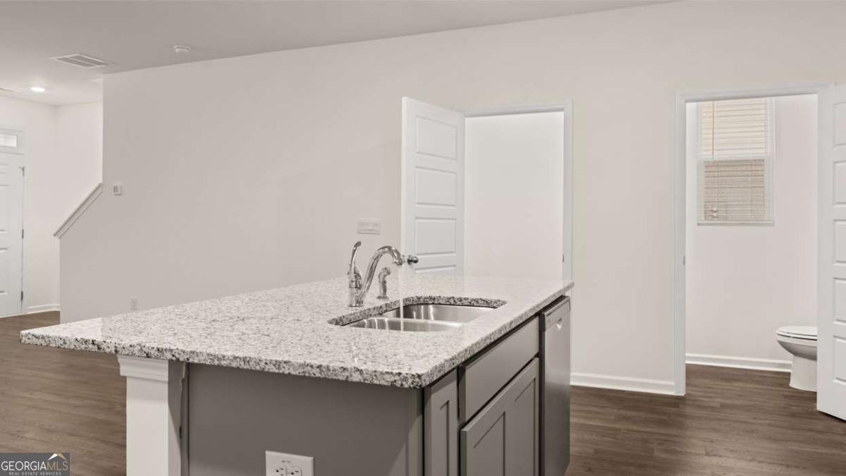 360 Sound Circle Stockbridge, GA 30281 - Photo 16 of 47 a bathroom with a granite countertop sink and a mirror