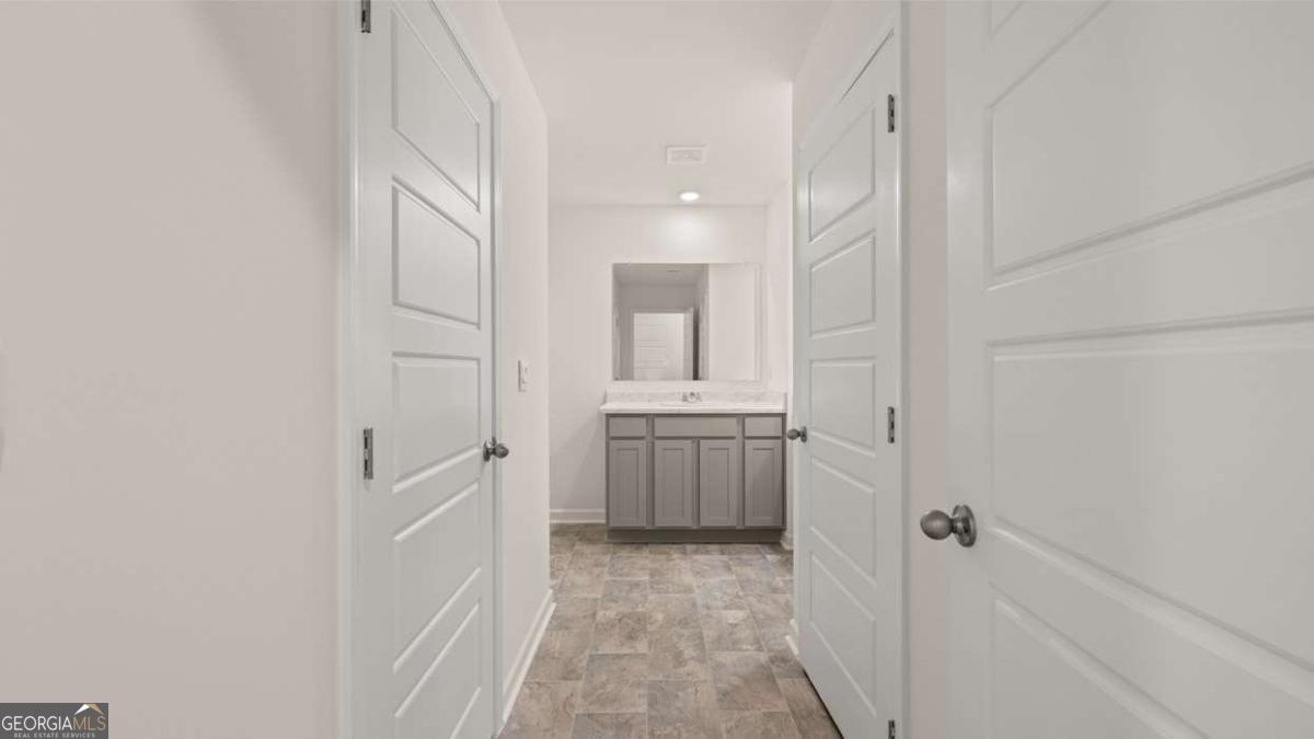 360 Sound Circle Stockbridge, GA 30281 - Photo 22 of 47 a bathroom with a sink and a mirror