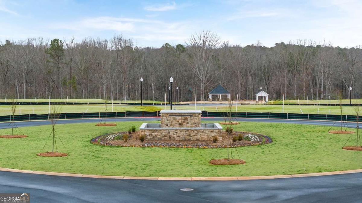 360 Sound Circle Stockbridge, GA 30281 - Photo 41 of 47 a view of a swimming pool with a lake view