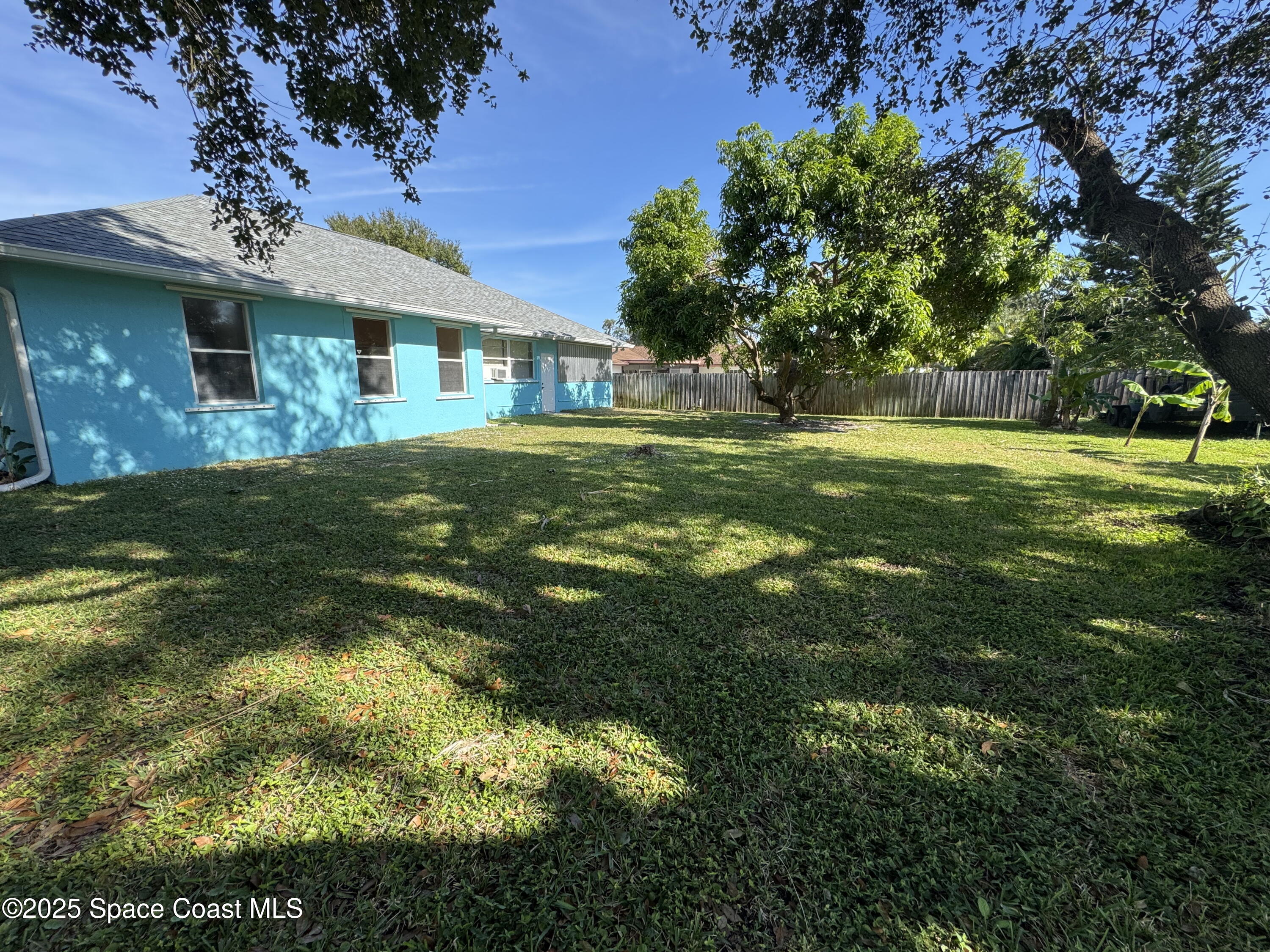 1522 Breese Street Northeast Palm Bay, FL 32905 - Photo 12 of 12 a view of a house with a big yard