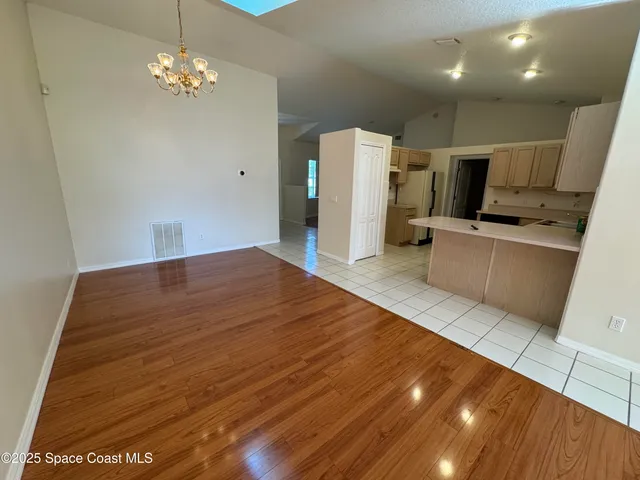 a kitchen with a stove a sink and a refrigerator