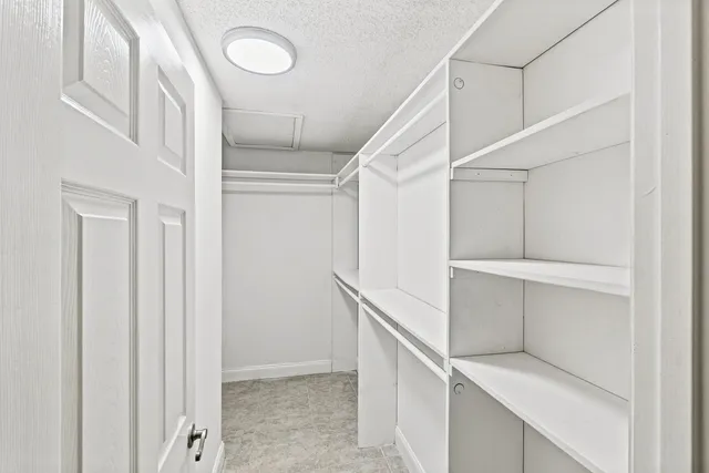 a view of an empty walk in closet
