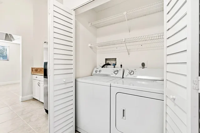 a kitchen with stainless steel appliances granite countertop a stove a refrigerator and a sink