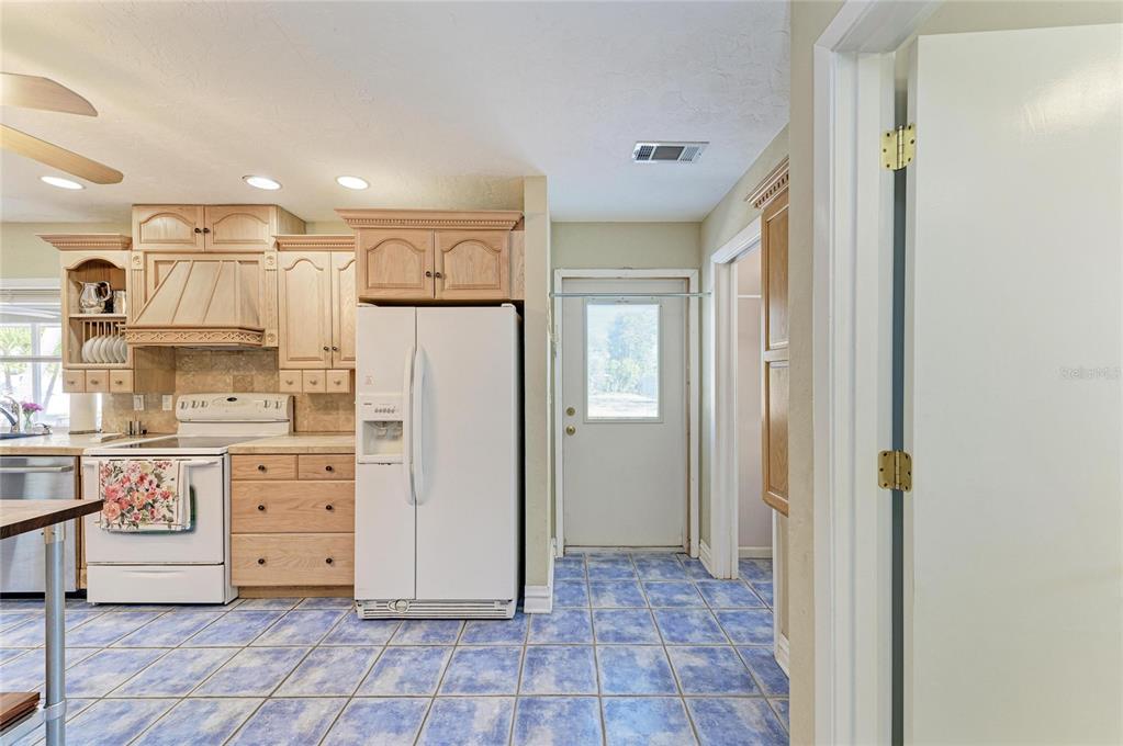612 Bayshore Road Nokomis, FL 34275 - Photo 16 of 96 a view of kitchen with stainless steel appliances granite countertop cabinets and window
