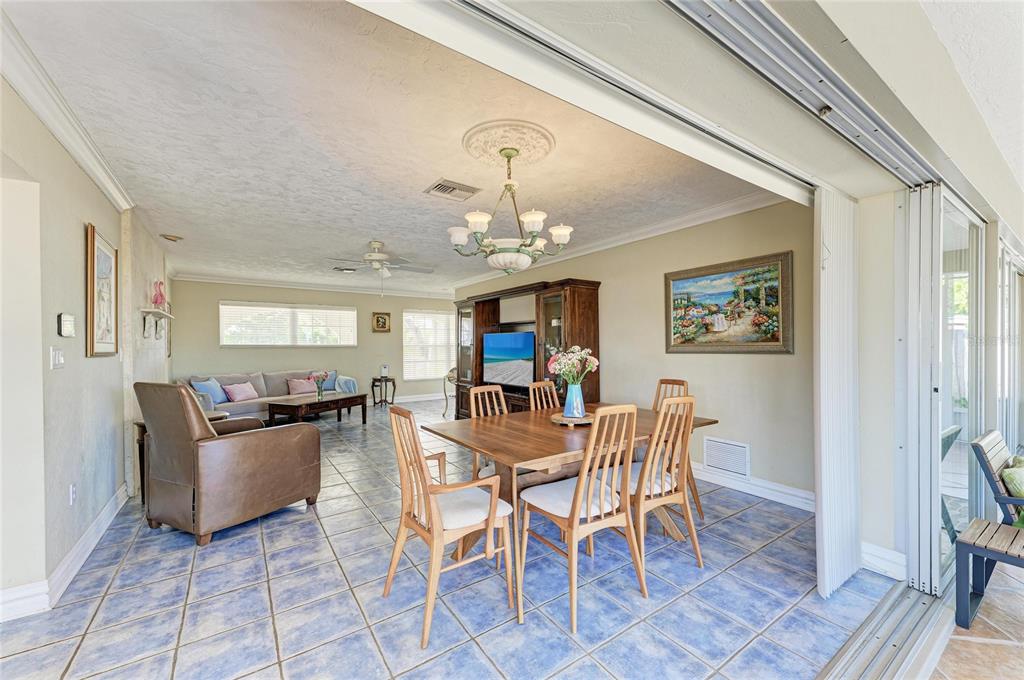 612 Bayshore Road Nokomis, FL 34275 - Photo 19 of 96 a view of a dining room with furniture and chandelier