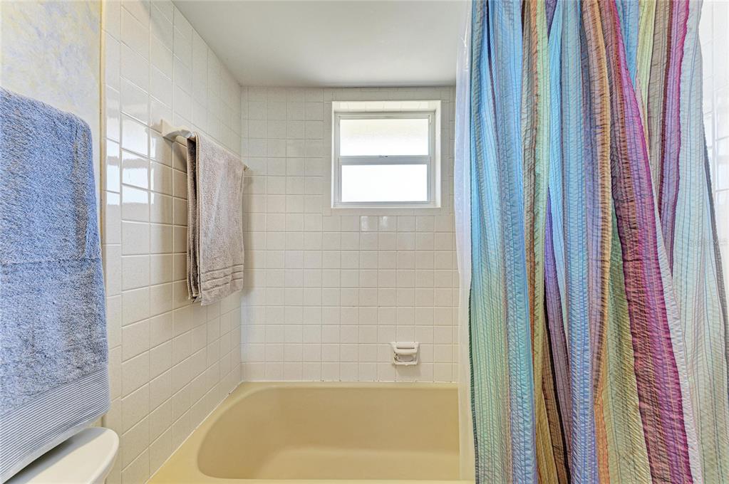 612 Bayshore Road Nokomis, FL 34275 - Photo 28 of 96 a bathroom with a bathtub and shower
