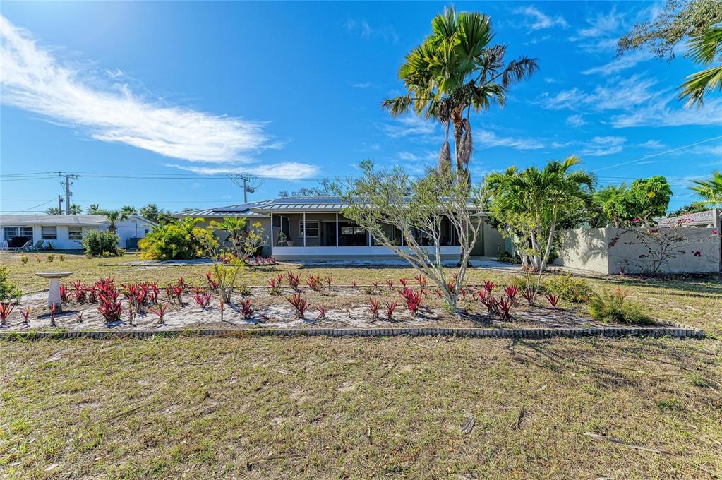 612 Bayshore Road Nokomis, FL 34275 - Photo 45 of 96 a view of swimming pool with a table and chair fire pit