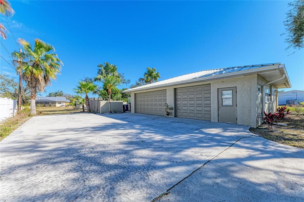 612 Bayshore Road Nokomis, FL 34275 - Photo 47 of 96 a view of a house with backyard and trees