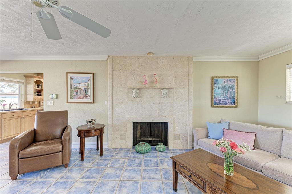 612 Bayshore Road Nokomis, FL 34275 - Photo 8 of 96 a living room with furniture and a fireplace