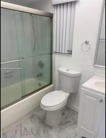 a kitchen with stainless steel appliances a sink and a refrigerator