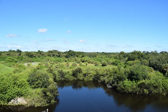 a view of a lake with houses in the back
