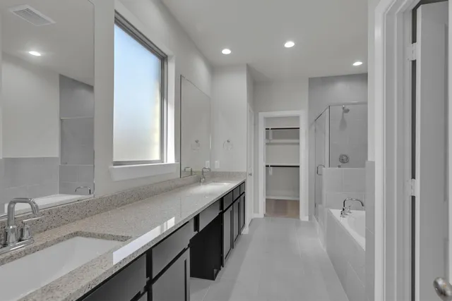 a kitchen with a sink appliances and cabinets