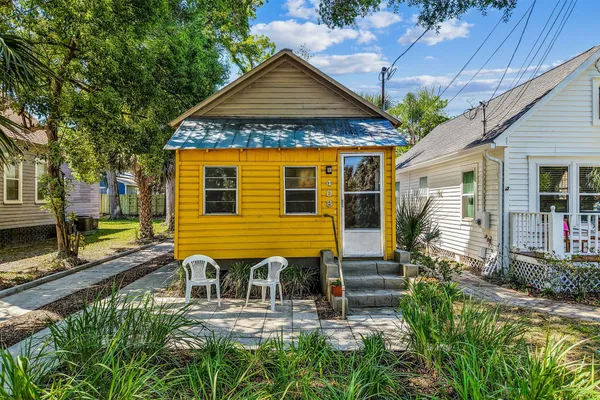 a front view of a house with a yard