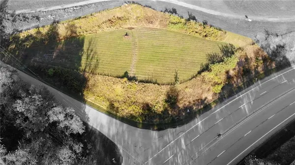 a view of a pathway both side of house