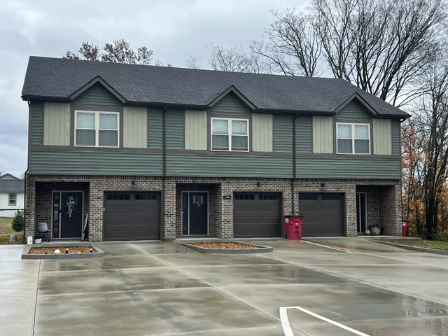 a view of a brick house with a large windows
